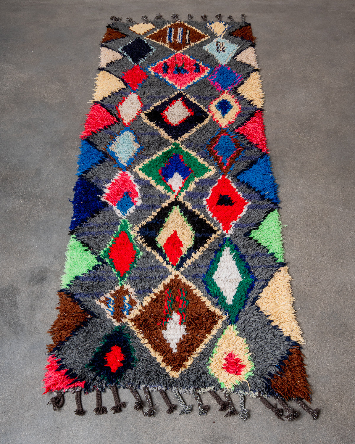 Modern designer vintage handcrafted Berber rug from Morocco. Boucherouite runner rug with beautiful colors and patterns.